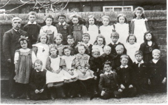 Schoolmaster Mr Marchant, with children at the Wilburton Primary School. Image: CCAN.