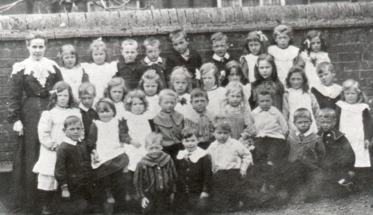 Mrs Alma Marchant with children from Wilburton Primary School, Cambridgeshire in about 1904.